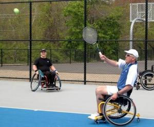 people playing tennis and using wheelchairs